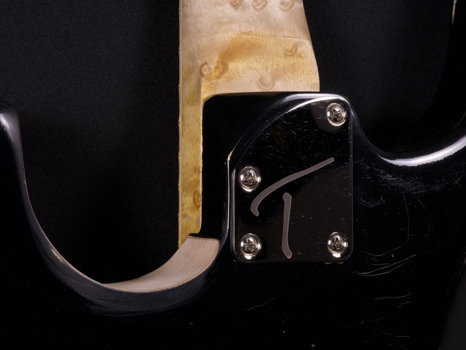 A guitar body being hand-shaped on the bench in the Hot Rod woodshop